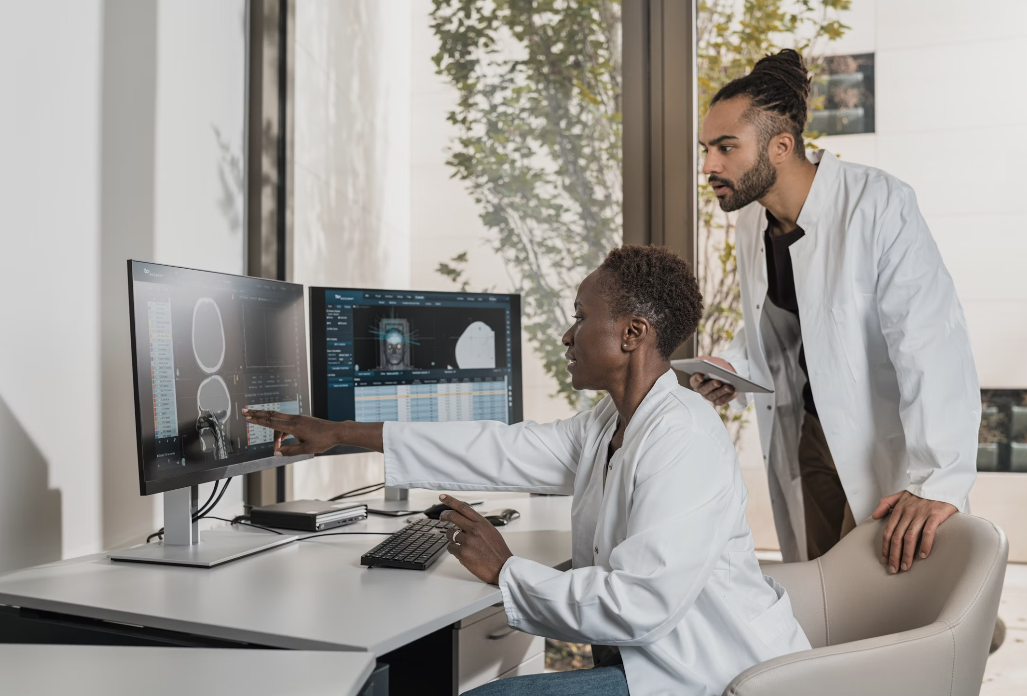 Doctors collaborating and reviewing medical imaging